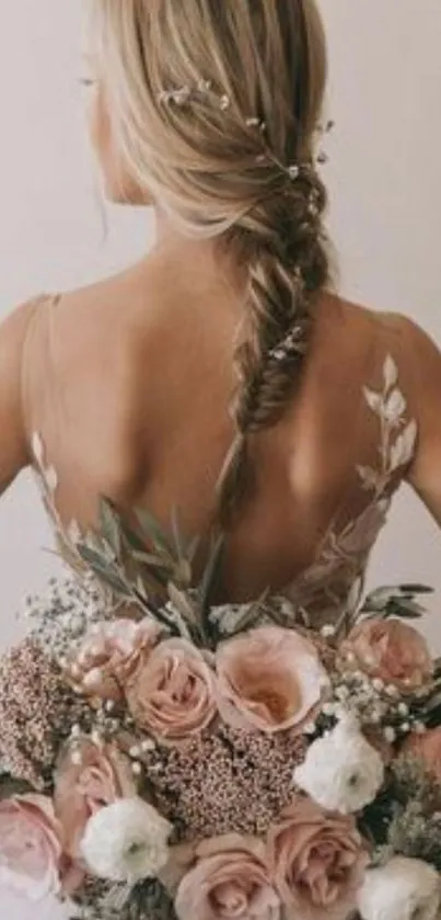 Bride with pink floral bouquet and braided hair.