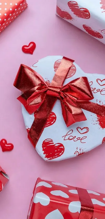 Pink background with red and white heart-shaped gifts.