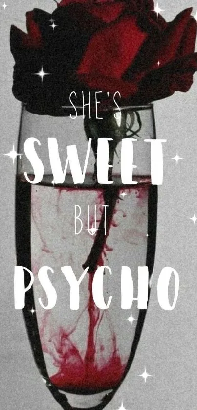 A red rose in a glass with text overlay 'She's Sweet but Psycho'.