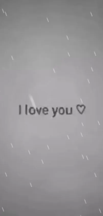 Grey wallpaper with 'I love you' text and heart symbol.