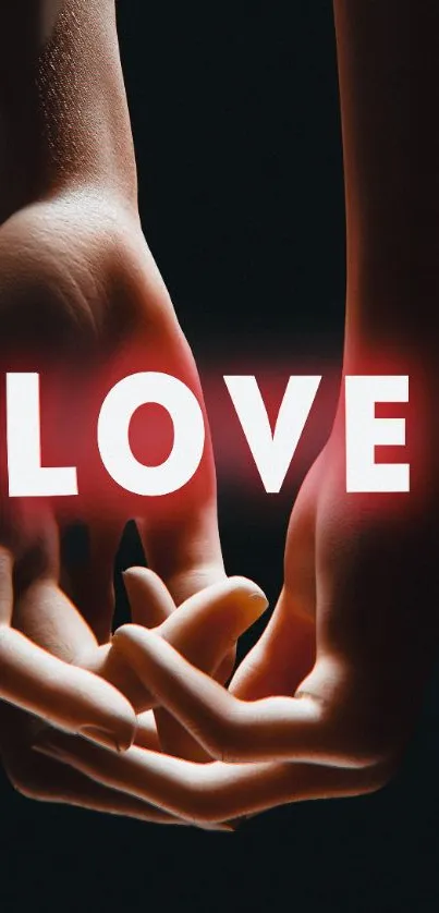 Romantic wallpaper with hands holding and glowing 'LOVE' text.