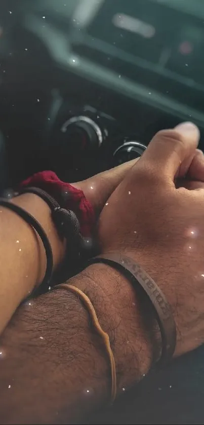 Close-up of two hands holding, creating a romantic mobile wallpaper scene.