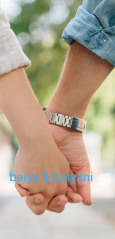 Hands holding in a romantic, natural setting wallpaper.