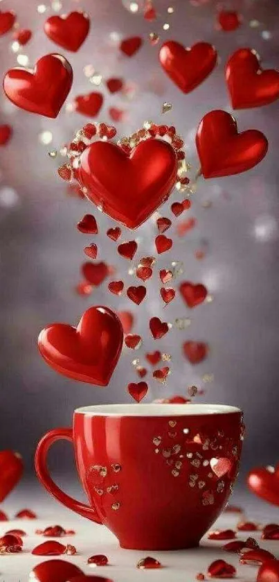 Red hearts floating above a matching red mug on a wallpaper.