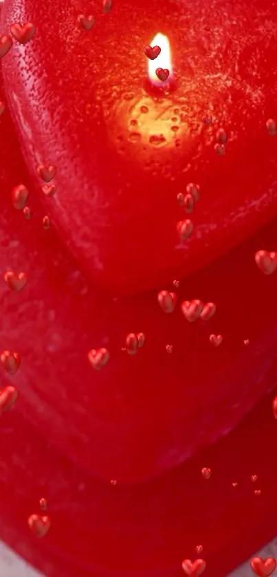 Heart-shaped red candle on wooden surface iPhone wallpaper.