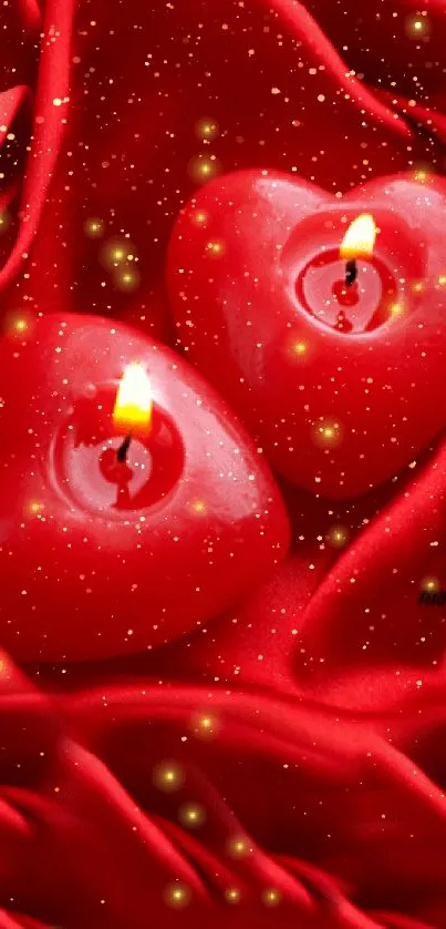 Heart-shaped candles glowing on red silky fabric.