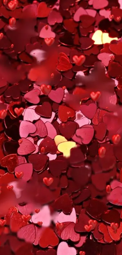 Romantic red heart confetti background with vibrant hues.