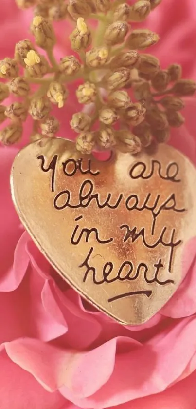 Heart charm with 'You are always in my heart' on pink petals.