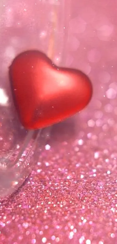 Romantic mobile wallpaper with red heart on pink glitter.