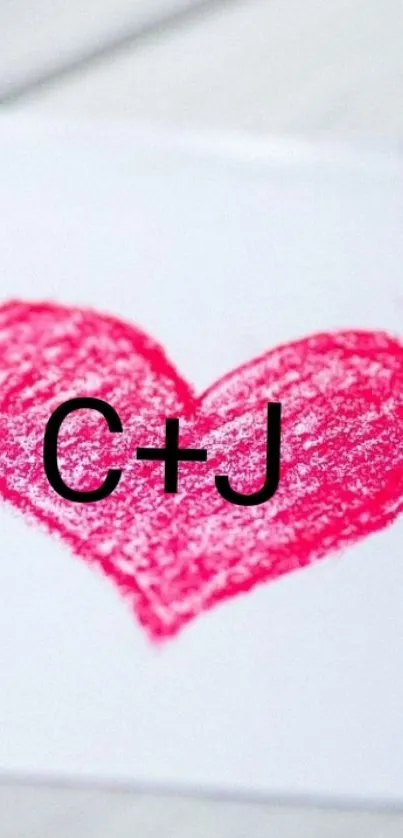 Pink heart with initials on white background.