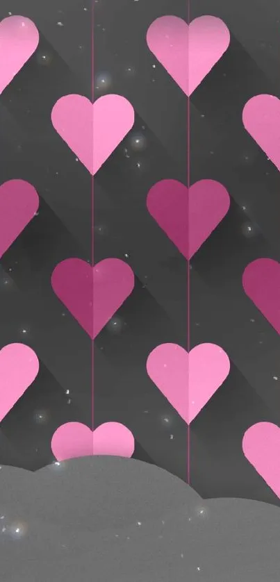 Pink and magenta heart pattern on dark wallpaper.