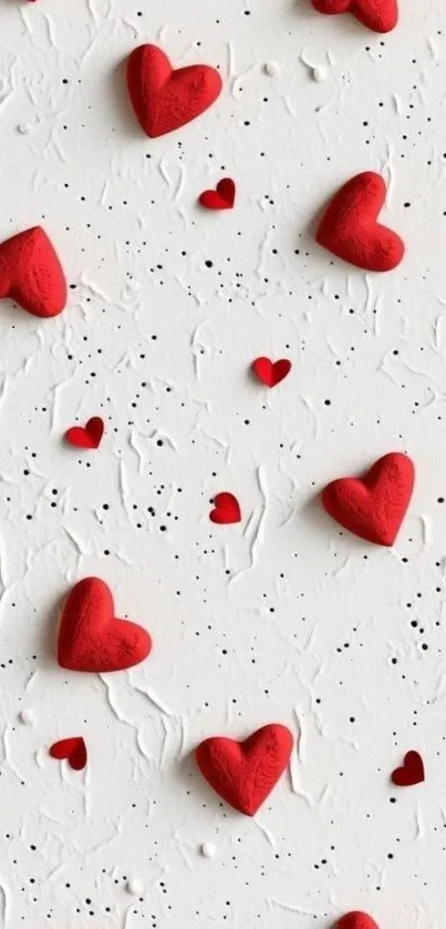 Mobile wallpaper with red hearts on white textured background.