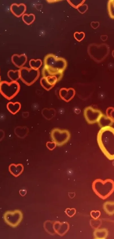 Mobile wallpaper with red and golden heart patterns on a dark red background.