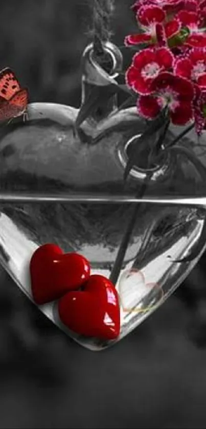Romantic glass heart with vibrant red flowers.