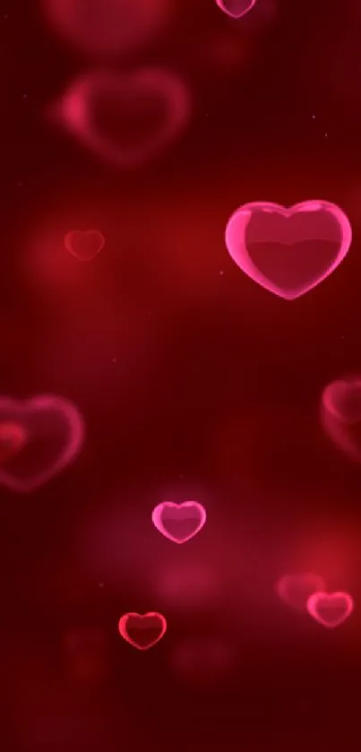 Romantic red glow wallpaper with floating hearts.