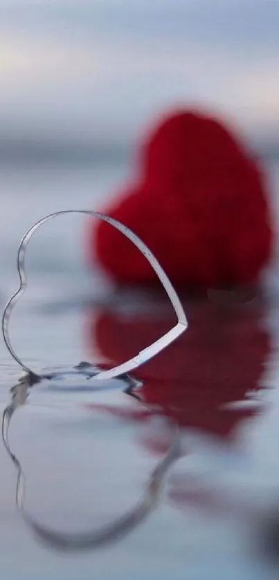 Heart silhouette reflecting on water with red background.