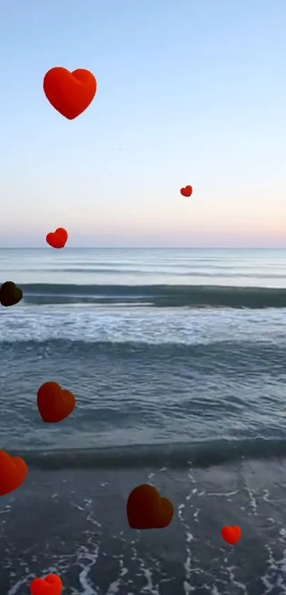 Floating red hearts over a serene sea view at sunset.