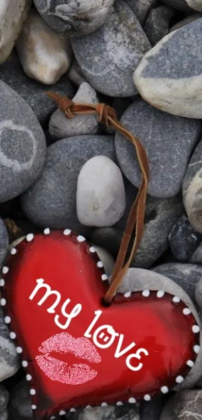 Red heart with 'my love' on stones background.