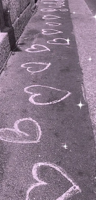 Purple pavement with white chalk hearts artfully drawn.