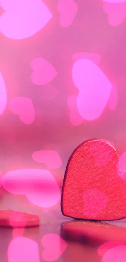 Romantic pink wallpaper with heart shape and blurred background.