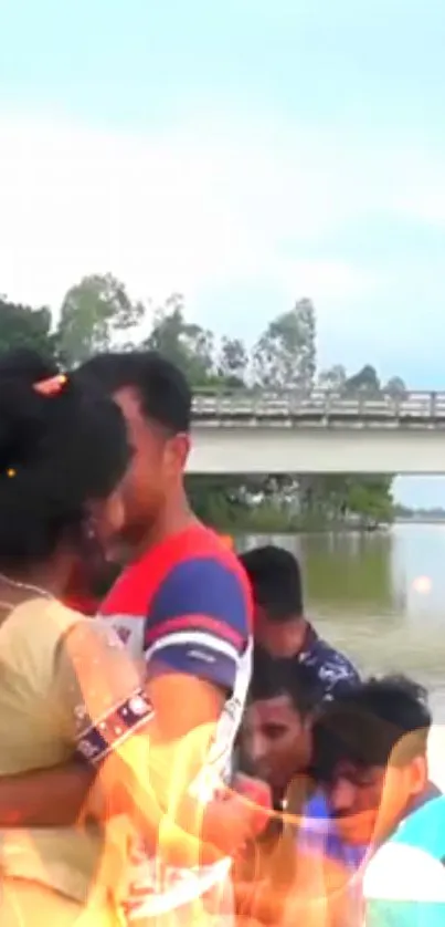 Romantic couple embracing by a serene lake with bridge visible.