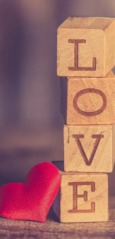 Wooden blocks spelling LOVE with a red heart.