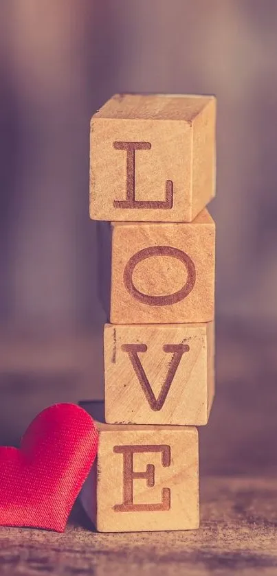 Wallpaper with wooden blocks spelling LOVE and a red heart.