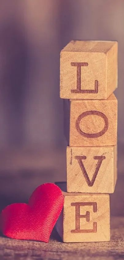 Wooden love blocks with a red heart.