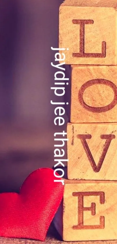 Wooden blocks spelling 'LOVE' with a red heart nearby.