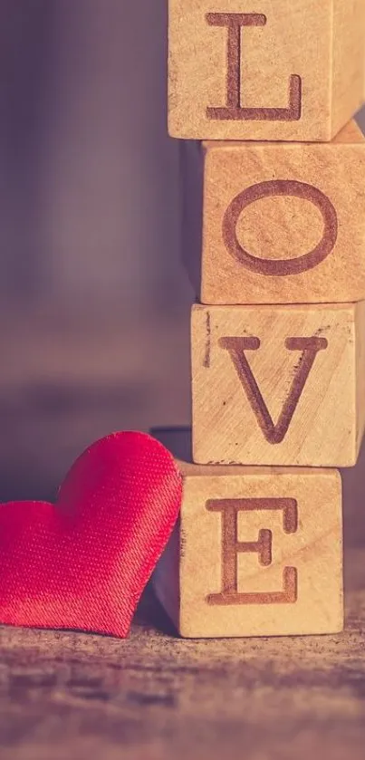 Wooden blocks spelling LOVE with a red heart.