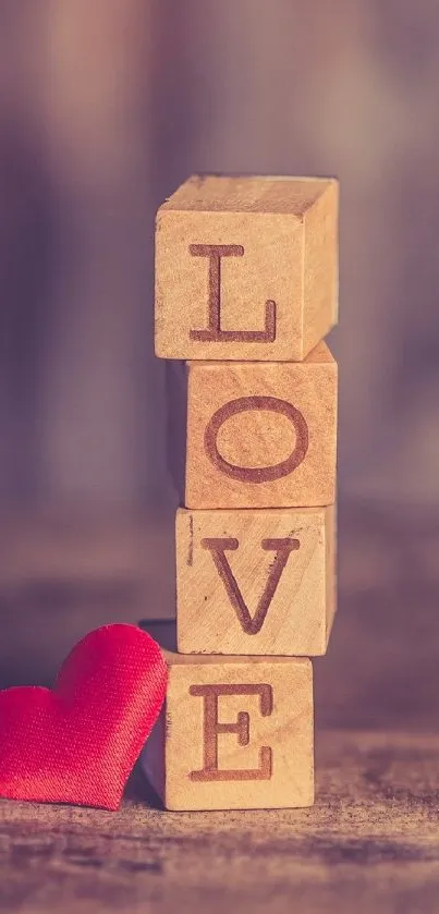 Wooden blocks spell LOVE with a red heart.