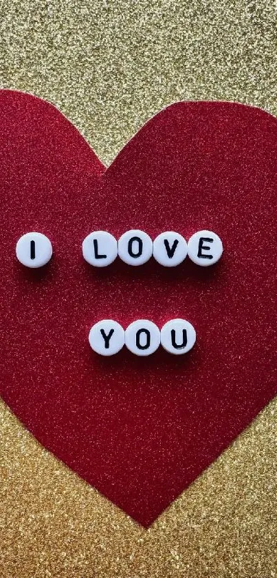 Red heart with 'I Love You' beads on gold background.