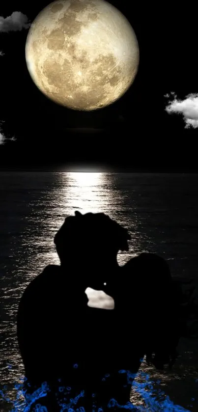 Silhouette couple kissing under full moon at night by the ocean.