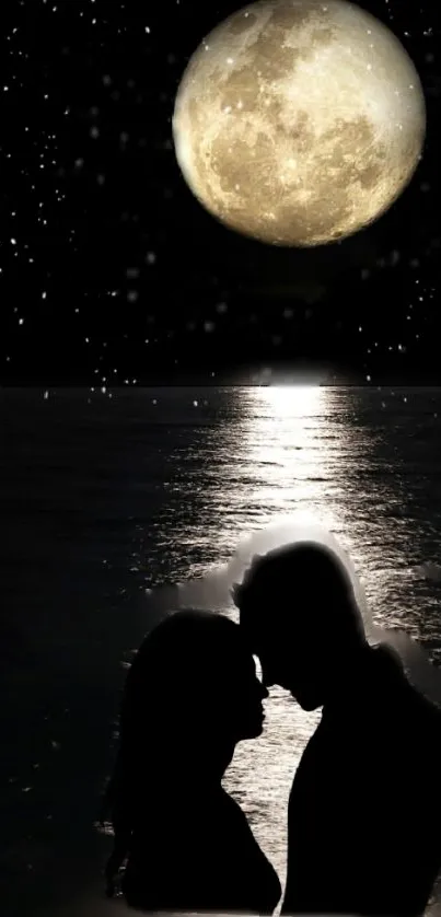 Silhouetted couple under moonlight by ocean.