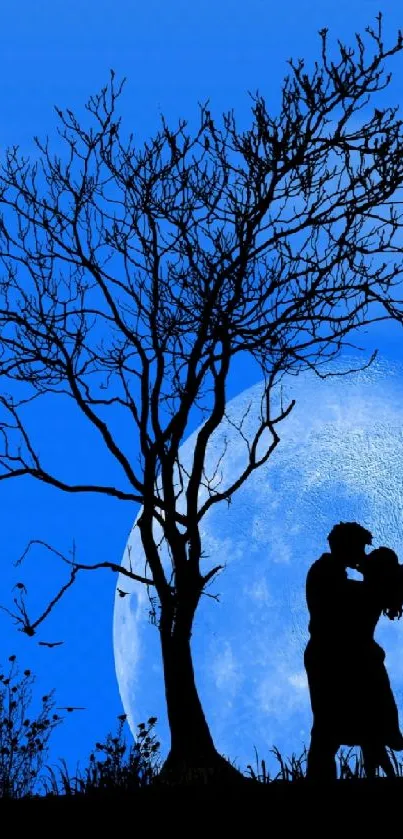 Silhouette of a couple kissing under a tree with a full moon backdrop.