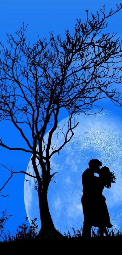 Romantic silhouette of couple under a blue moonlit sky wallpaper.