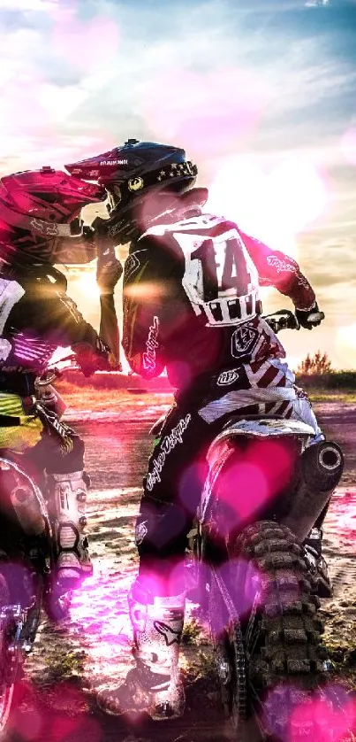 Motocross couple shares a moment during sunset ride with pink heart accents.