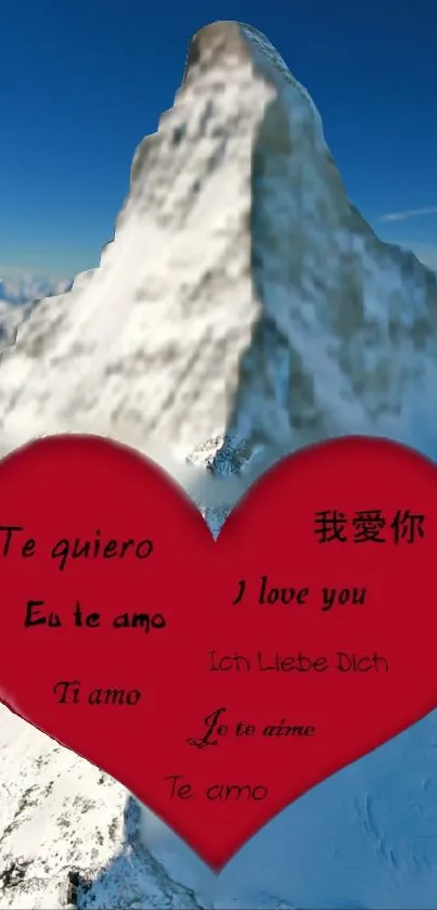 Heart with love messages on a snowy mountain backdrop.