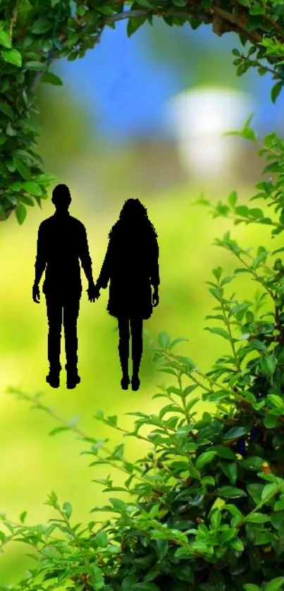 Silhouette of couple with green foliage and blue sky background.