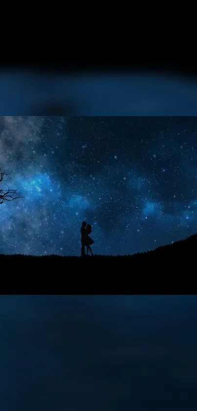 Couple silhouette against starry night sky with dark blue tones.