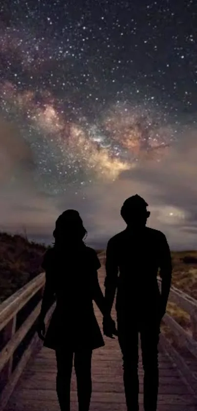 Couple silhouetted against a starry night sky wallpaper.