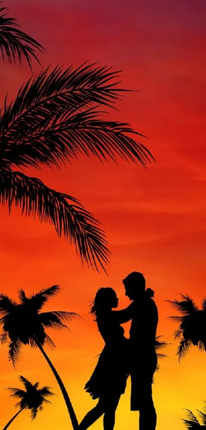 Silhouetted couple under vibrant sunset with palm trees.