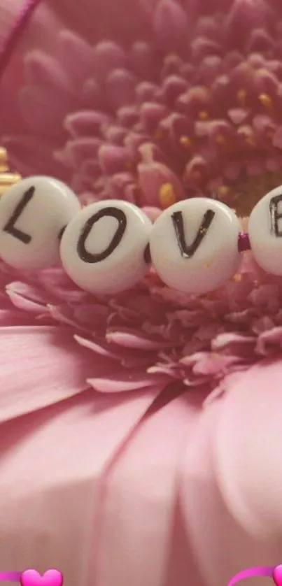 Love beads on pink flower with hearts wallpaper.