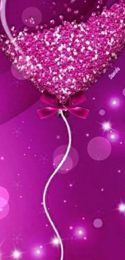 Heart-shaped pink balloon with sparkles on a magenta background.