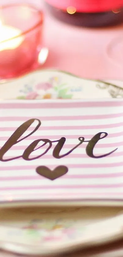 Pink striped wallpaper with love script and heart design.