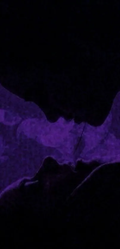 Purple silhouette art of romantic couple on phone wallpaper.