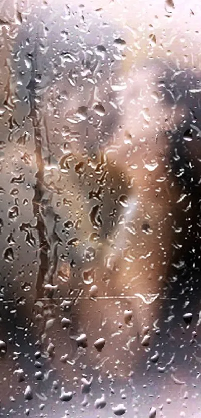 Romantic rainy wallpaper with blurred figures behind water droplets.