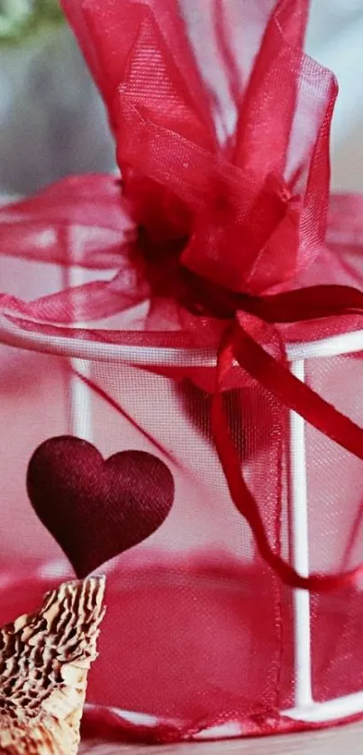 Red gift box with heart accent wallpaper.