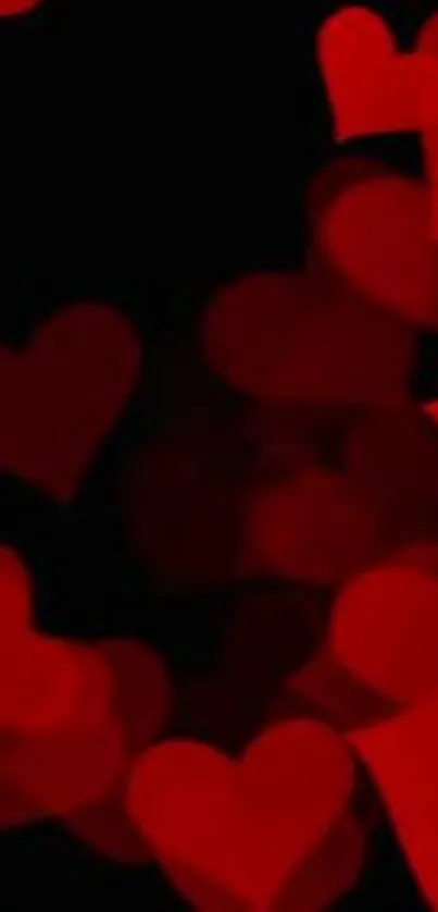 Romantic wallpaper with red hearts on black background.