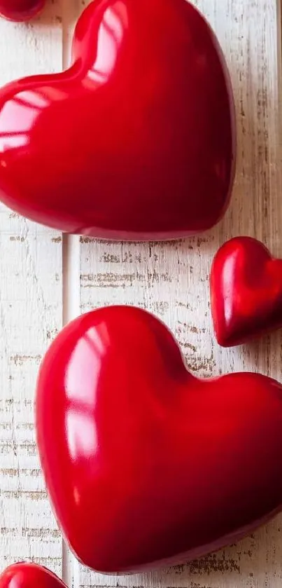 Red heart shapes on wooden background, perfect for romantic vibes.